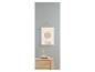Une commode en bois avec un poster avec deux cercles au-dessus
