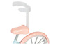 Een roze kinderfiets met een veiligheidsbeugel.
