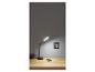 Lampe de bureau LED noire avec chargeur sans fil sur un bureau en bois.