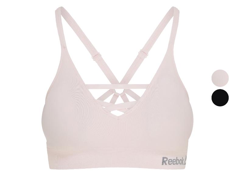 Soutien-gorge de sport rose clair avec bretelles croisées au dos et bande texturée subtile