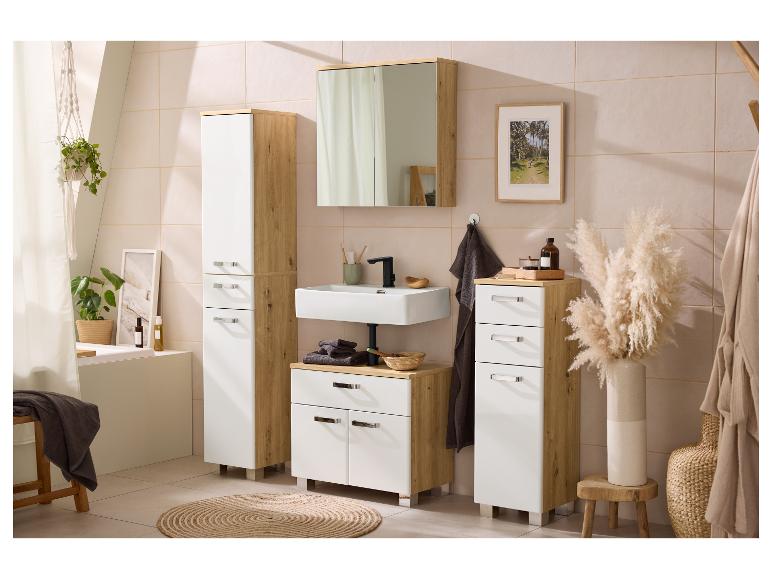 Salle de bain moderne avec meubles blancs et aspect bois, lavabo, miroir et plantes décoratives.