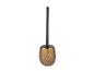 Brosse de toilette dorée avec manche noir.