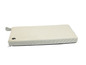 Een beige hondenbed met een zwarte pootprint.