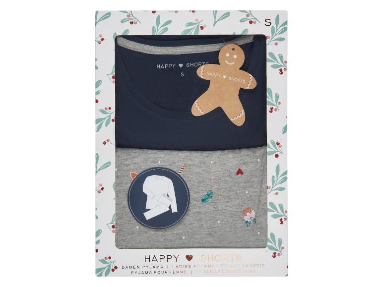 Un emballage avec un pyjama bleu et gris avec un short pour femmes de Happy Shorts.