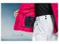 Roze ski-jas met binnenzak en witte ski-broek.