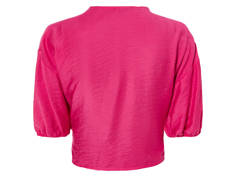 Een roze blouse met ballonmouwen.