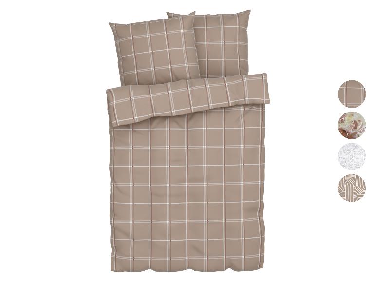 Bruin geruit beddengoed met kussenslopen en een dekbedovertrek.