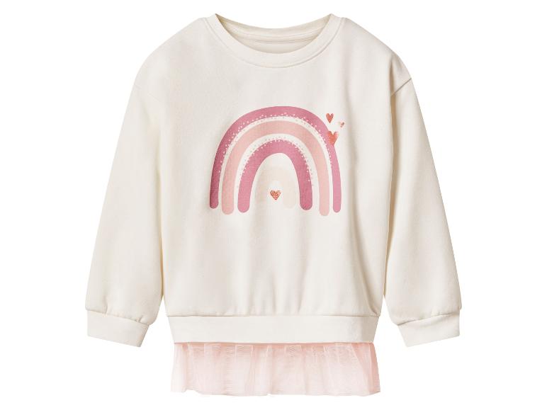 Sweat-shirt crème à manches longues avec un arc-en-ciel rose et des cœurs, avec un ourlet en tulle rose.
