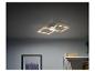 Un luminaire de plafond LED moderne et rectangulaire dans une pièce.
