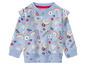 Un sweat-shirt bleu avec un motif floral et des arcs-en-ciel
