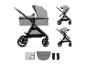Poussette bébé grise avec nacelle et options de siège, plus accessoires.
