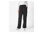 Pantalon noir avec taille élastique et baskets blanches.