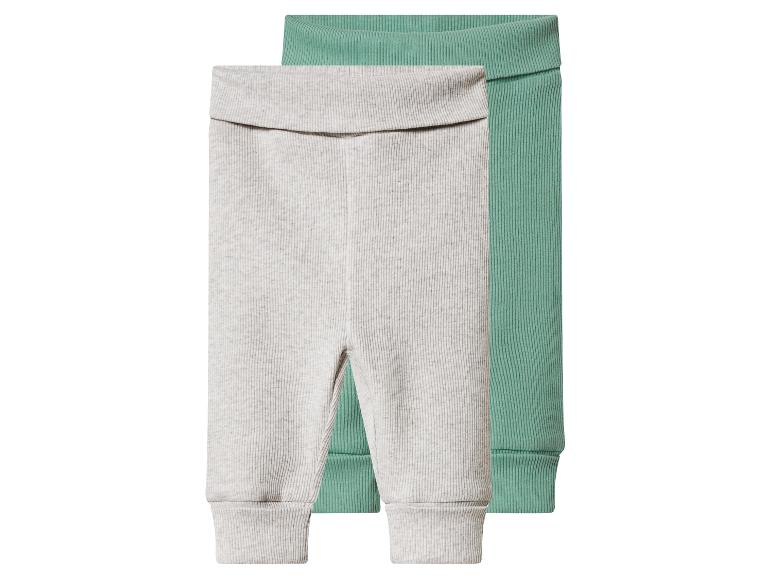 Deux paires de leggings côtelés pour bébé, un gris clair et un vert menthe.