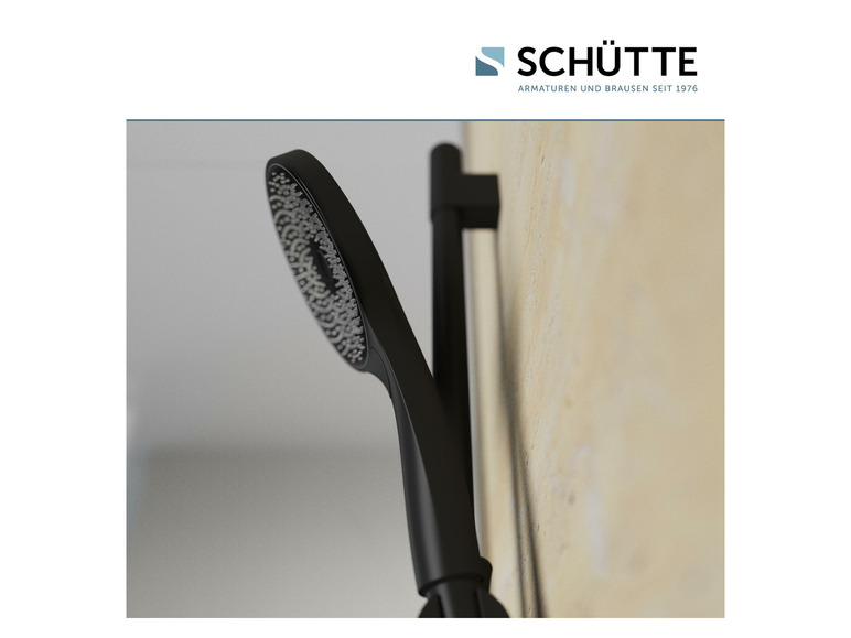 Une pomme de douche noire et une barre de douche de la marque Schütte.