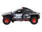 Un modèle de jouet de voiture de rallye Audi e-tron noir.