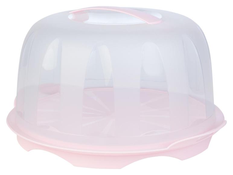 Un protège-gâteau en plastique rose avec un couvercle.