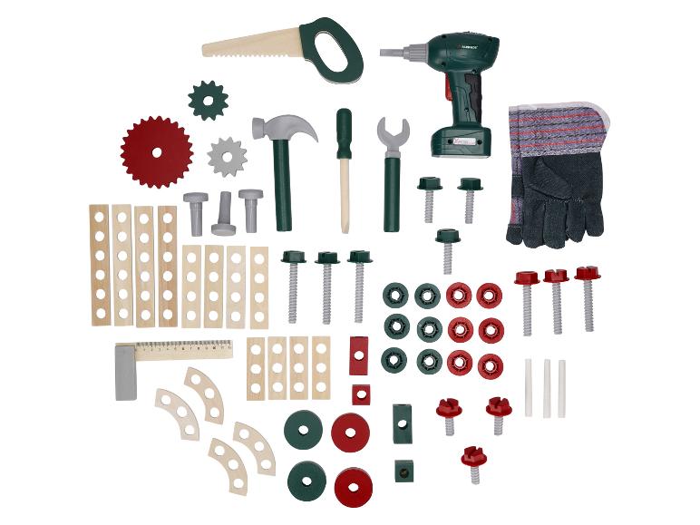 Un ensemble de construction jouet avec des outils comme une perceuse, une scie, un marteau et des pièces.