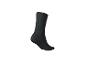Une chaussette noire sur fond blanc.