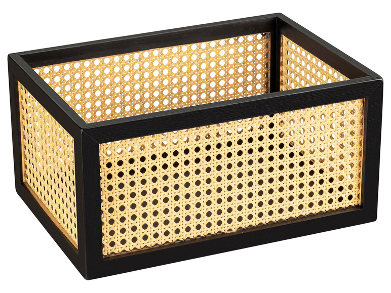 Une boîte de rangement noire avec un motif tressé.