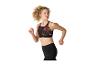 Vrouw in sportbeha en legging aan het hardlopen