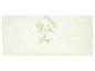 Oreiller blanc avec impression verte de feuilles de bambou et le mot 'Bamboo'.