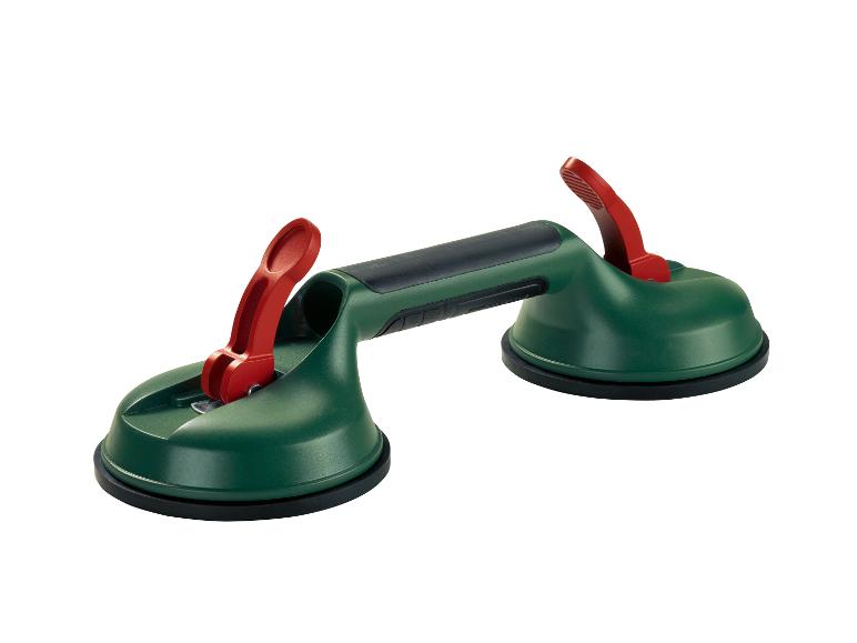 Ventouse verte avec deux leviers rouges pour manipuler carreaux ou verre.