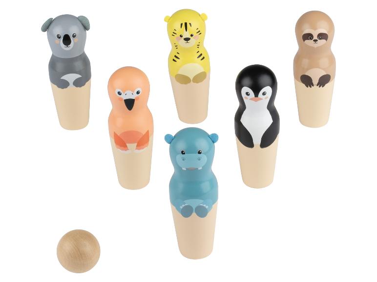 Un jeu de quilles en bois avec des figurines d'animaux, y compris une boule.