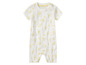 Witte baby romper met gele luchtballonnen.