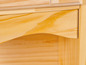 Close-up van een houten kast met een lade.
