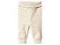 Pantalon bébé côtelé beige avec revers et taille large et pliable.