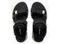 Une paire de sandales de sport noires avec des accents vert menthe.
