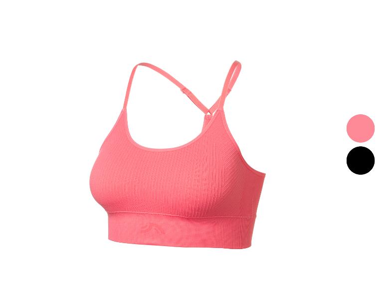 Roze geribbelde sportbeha met verstelbare bandjes.