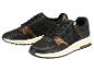Zwarte en gouden damessneakers met rits