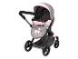 Een roze en grijze kinderwagen met een eenhoorn ontwerp.