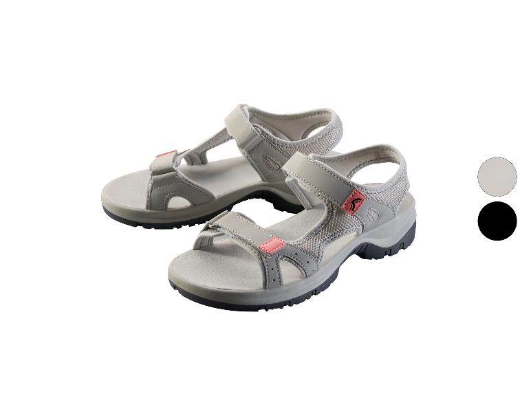 Sandales grises avec des accents roses et des semelles noires, avec des échantillons de couleurs gris et noir.
