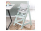 Une chaise haute pour enfant Roba de couleur vert menthe avec un coussin gris et un plateau.