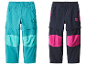 Deux pantalons convertibles pour enfants, un turquoise et un bleu marine avec des détails roses.