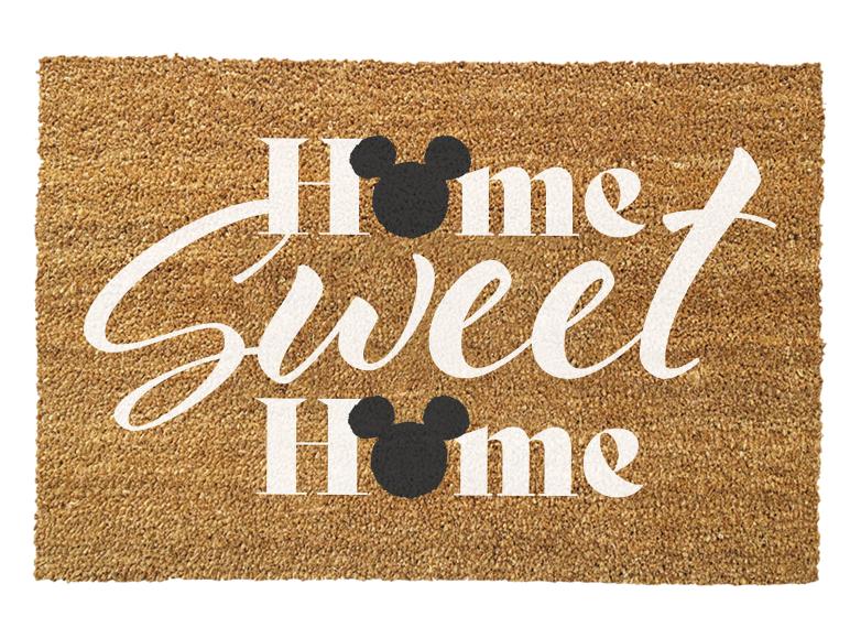 Paillasson marron avec l'inscription 'Home Sweet Home' et des têtes de souris noires.