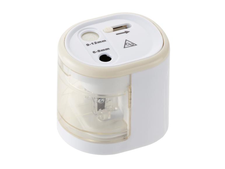 Taille-crayon électrique blanc et beige avec deux trous d'affûtage (6-8mm et 9-12mm).