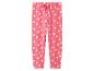 Roze joggingbroek voor kinderen met witte madeliefjes en een roze strik