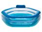 Piscine gonflable bleue et blanche avec appui-tête gonflable.