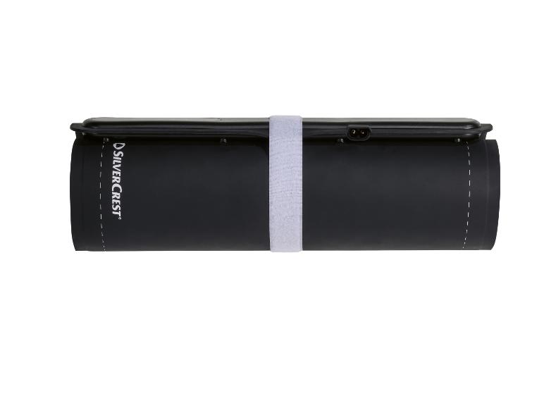 Couverture chauffante roulée avec fermeture velcro.