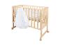Lit bébé en bois avec gigoteuse blanche à motifs de lune et d'étoiles