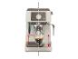 Machine à expresso avec une tasse de café et un plateau réglable.