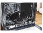 Een oven met een Silvercrest gietijzeren pan erin.