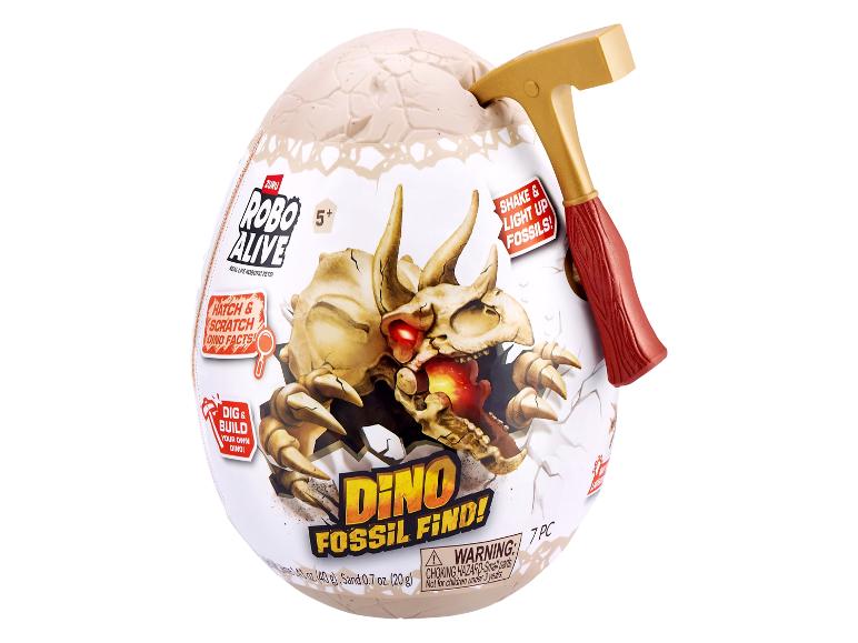 Œuf Robo Alive Dino Fossil Find avec un marteau jouet, représentant un crâne de dinosaure.