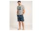 T-shirt gris homme avec imprimé palmier et short à carreaux.