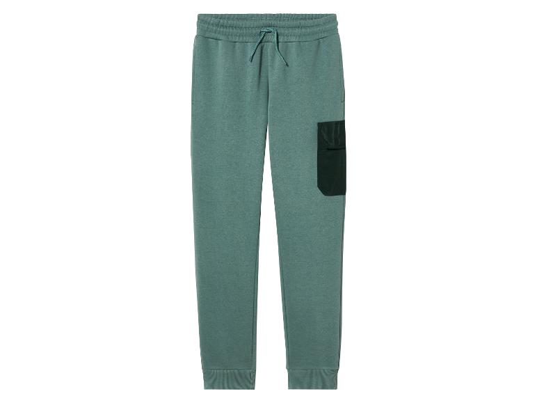 Groene joggingbroek met een zak op de dij.
