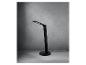 Lampe de bureau LED noire avec base de chargement sans fil sur fond gris.
