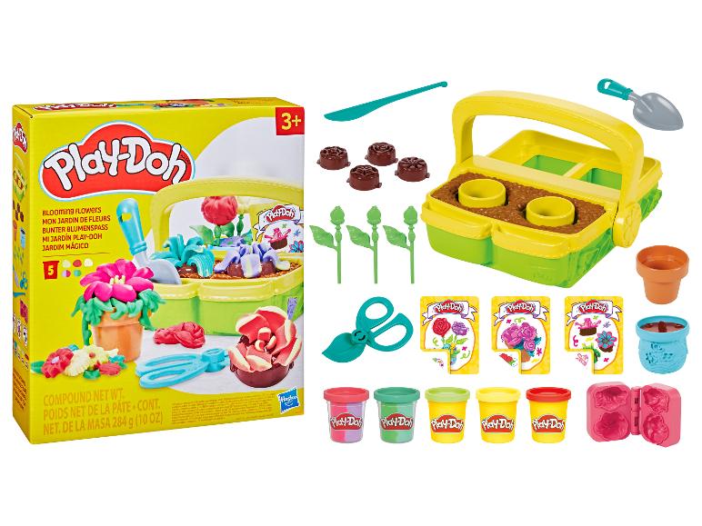 Ensemble de jeu Play-Doh Blooming Flowers avec pâte à modeler, outils de jardinage et moules à fleurs.